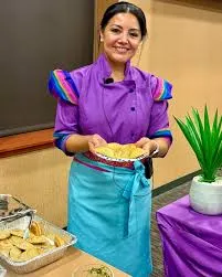 Chef Violet holding empanadas