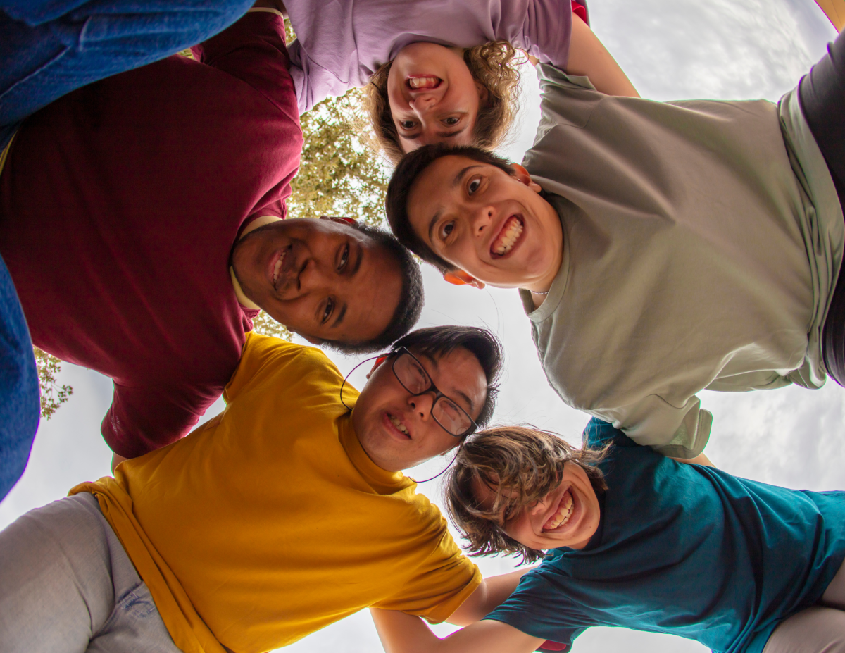 Four People Enjoying Themselves, Laughing while looking at the Camera