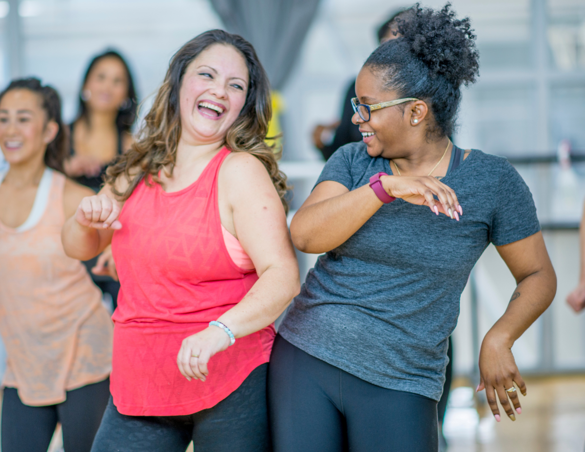Two women enjoy Zumba just like you would at the SHPL