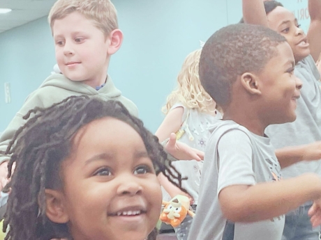 Winter Newsletter cover with kids singing and playing